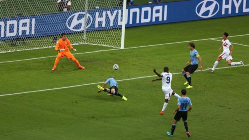Joel Campbell of Costa Rica scores the equaliser  past Fernando Muslera of Uruguay   at Castelao in Fortaleza, Brazil. Photograph: Michael Steele/Getty Images