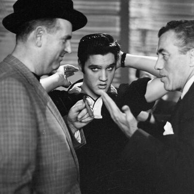 Elvis Presley with his manager Colonel Tom Parker backstage before the singer appeared on the Ed Sullivan show, in New York in October 1956. Photograph: CBS Photo Archive/Getty Images