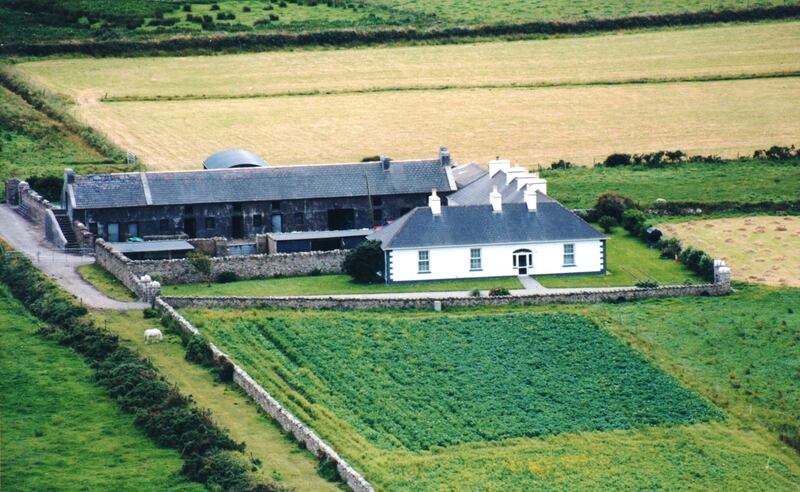 House after lime render was replaced with cement and decorative cornerstones were added