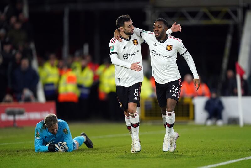 Manchester United's Bruno Fernandes celebrates scoring his sides third goal with Anthony Elanga. Photograph: Mike Egerton/PA