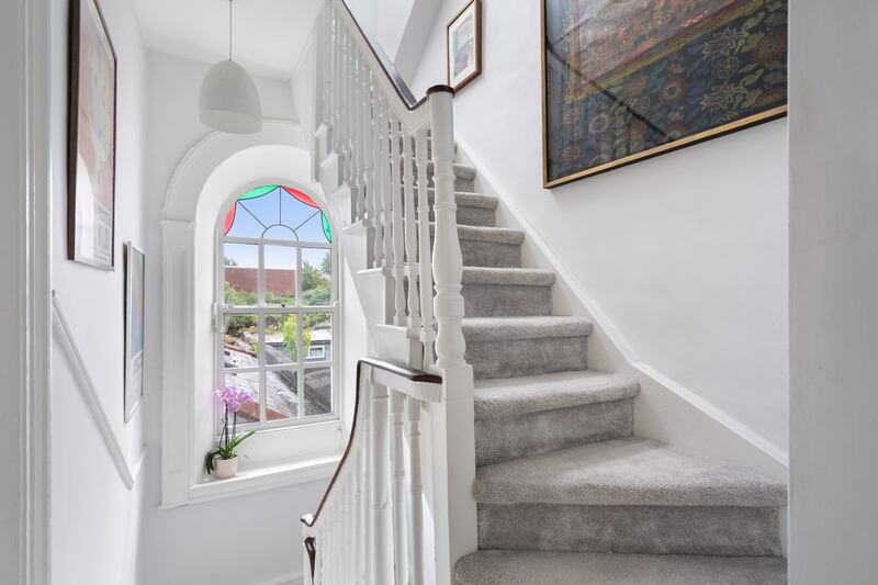 Arched window floods the stairs with light