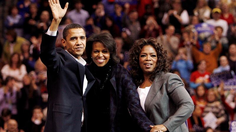 Barack Obama with his wife, Michelle, and host Oprah Winfrey at a campaign rally in 2007. Photograph: Brian Snyder/File Photo/Reuters
