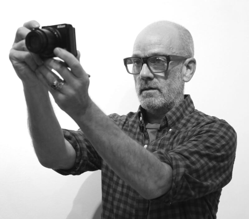 Michael Stip takes a photograph: he spends his time as a visual artist since REM. Photograph:  Adam Berry/Getty
