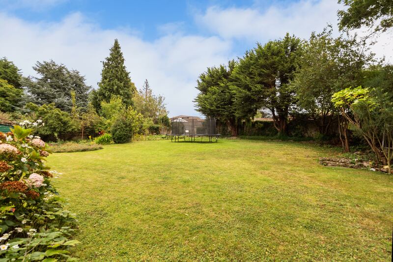 The grounds extend to half an acre