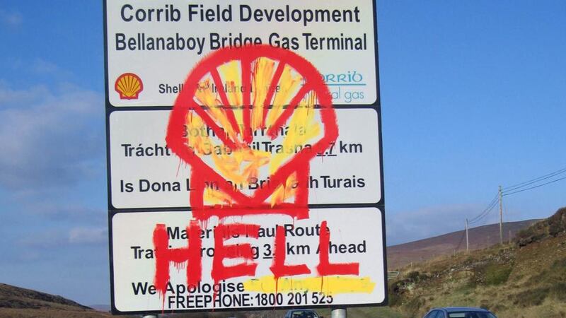 A road sign painted with graffiti stands outside the village of Rossport, Co Mayo. Photograph: Reuters