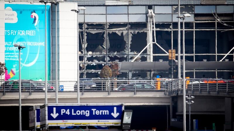 The shattered glass facade of the departure hall at Brussels Airport in Zaventem ollowing twin blasts. Photograph: Virginie Lefour/AFP/Getty Images