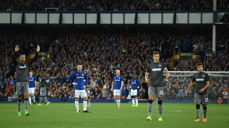 Everton and Hajduk Split players pause after Split fans spill onto the pitch after conceding the first at Goodison Park. Photograph: Oli Scarff/AFP