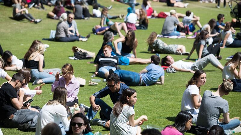 People enjoy the sunshine in Trinity College Dublin. Photograph: Tom Honan