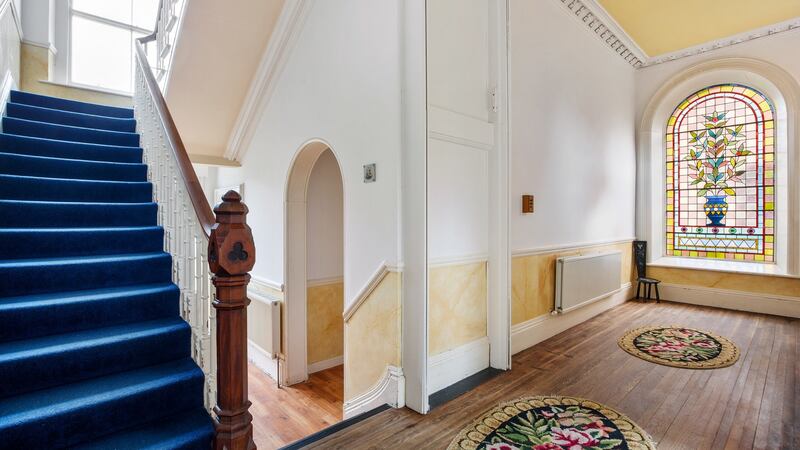Entrance hall with stained-glass window