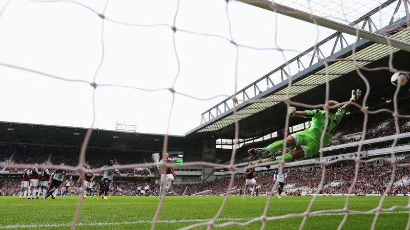 Leighton Baines of Everton scores from a freekick past Jussi Jaaskelainen  at the Boleyn Ground. Photograph:  Ian Walton/Getty Images