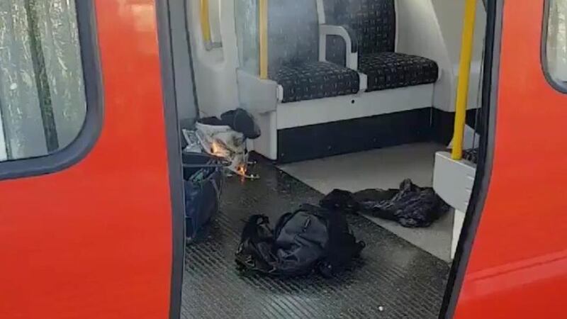 Parsons Green explosion: the bucket containing the improvised device smoulders after the attack. Photograph: Sylvain Pennec via Reuters