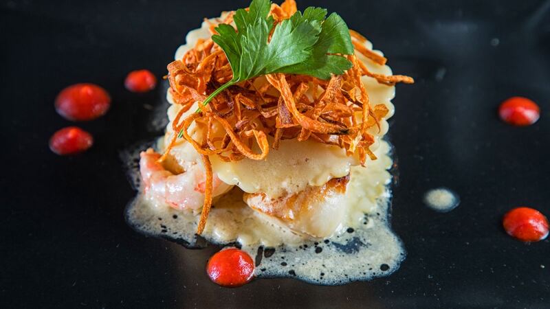 Open ravioli of seared scallops and prawns from the menu at Rozzers.