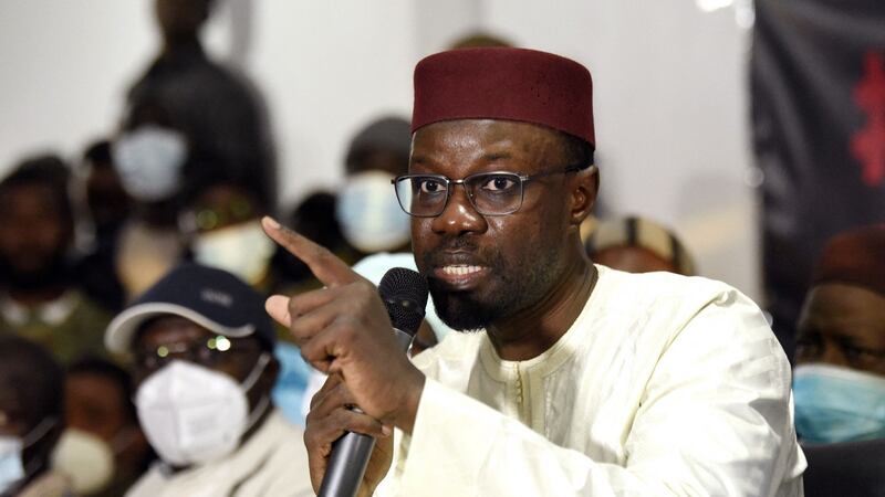 Opposition leader Ousmane Sonko, charged with rape, gestures as he talks to media at his party’s headquarters in Dakar on Monday after being freed from detention. Photograph: Seyllou/AFP via Getty Images
