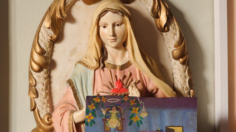 The Virgin Mary was a gift and Niamh McCann hangs Mexican votives from it. In Mexico these little features are painted as pleas to the saints or the gods or the Marys.