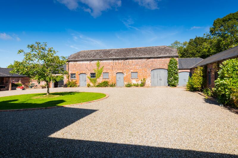Clonganny House: Each of the house’s four courtyard suites, with bedrooms and sitting areas, open on to private patios within the walled garden, close to the woods.