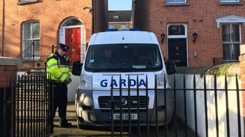 Gardaí outside the apartment on Gardiner St where the woman was killed. Photograph: Elaine Edwards