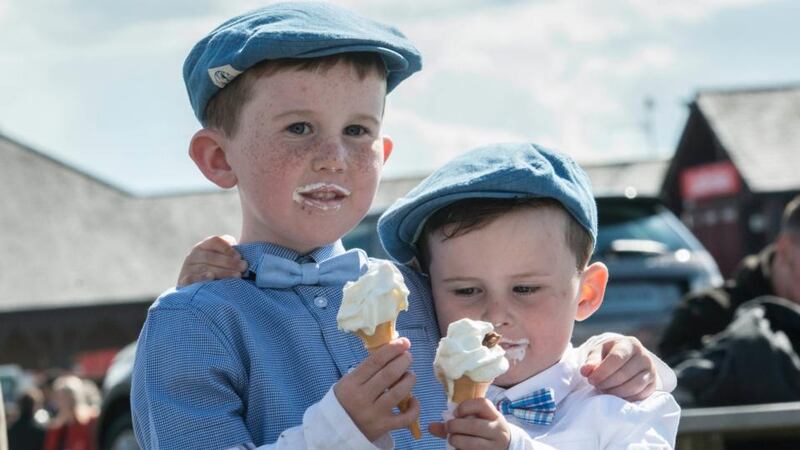 Cody Kenny (5) from Offaly with his brother Reece (3) enjoying a festival treat day three  of the Punchestown Racing Festival. Photograph: Brenda Fitzsimons/The Irish Times