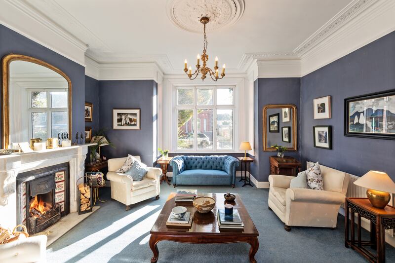 The drawingroom features a marble fireplace and has a deep bay window overlooking the front garden