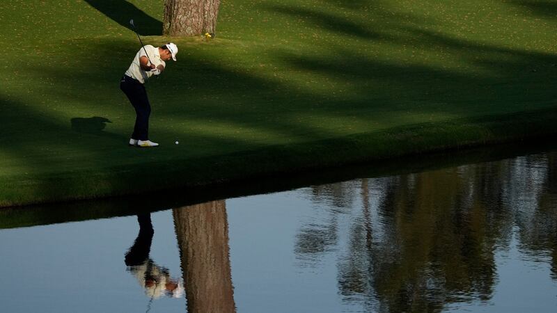 Matsuyama pitches from the back of the 15th after finding the water. Photo: Gregory Bull/AP Photo