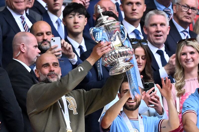 Pep Guardiola lifts the FA Cup after Manchester City's victory over Manchester United in the final. Last February, the English Premier League announced it was investigating Manchester City for 115 breaches of its financial fair play regulations during the period 2009-2018. Photograph: Glyn Kirk/AFP via Getty Images