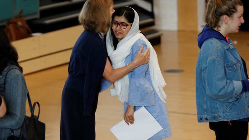 Malala Yousefzai is congratulated after collecting her A-Level exam results at Edgbaston High School for Girls in Birmingham, UK. Photograph: Darren Staples/Reuters