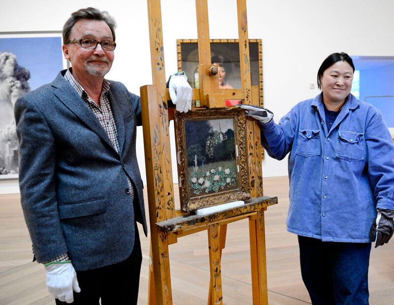 Lars Bystrom of the Museum of Modern Art in Stockholm with Matisse’s recovered Le Jardin. Photograph: Jonathan Nackstrand/AFP/Getty