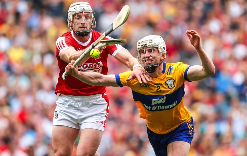 Cork's Patrick Horgan and Adam Hogan of Clare during the All-Ireland final. County players are now back with their clubs.  Photograph: Bryan Keane/Inpho 