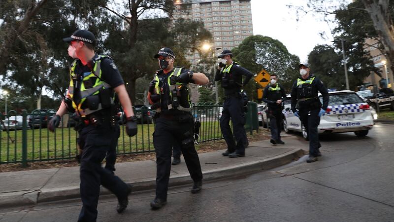Police enforce a lockdown at public housing towers on Racecourse Road in Flemington, Melbourne, Australia. Photograph: David Crosling/EPA