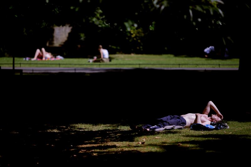 Feeling the heat in St Stephen’s Green - with a high temperature warning for all of Ireland will come into effect at midday on Saturday, with temperatures of up to 30 degrees Celsius possible in some areas. Photograph: Chris Maddaloni/The Irish Times