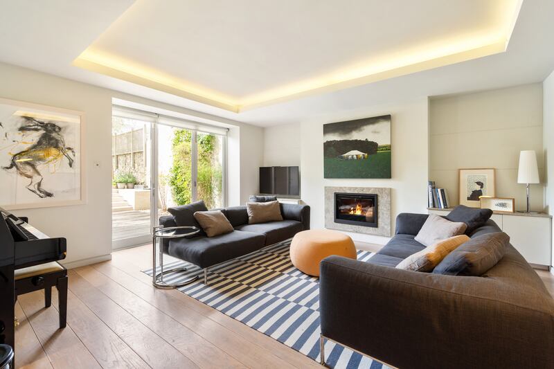 Family room at garden level opens to the garden. Photograph: Angela Mujica