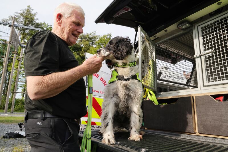 Dr Neil Powell, president and founding member of Sarda IN, with Nelly, a cadaver dog. Photograph: Alan Betson 