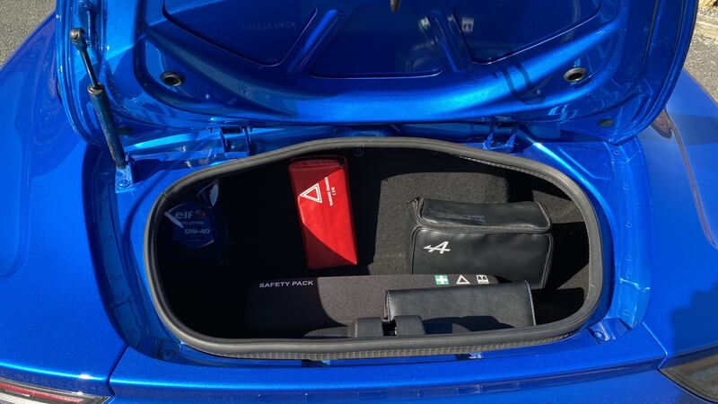 There are two small boots, front and rear, and plenty of leg and elbow room for the two occupants