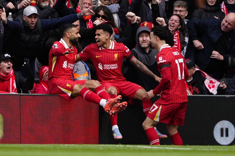 Liverpool's Luis Diaz (centre) celebrates with Mohamed Salah (left) and Curtis Jones (right) after scoring his side's first goal during the Premier League match at Anfield. Photograph: Peter Byrne/PA