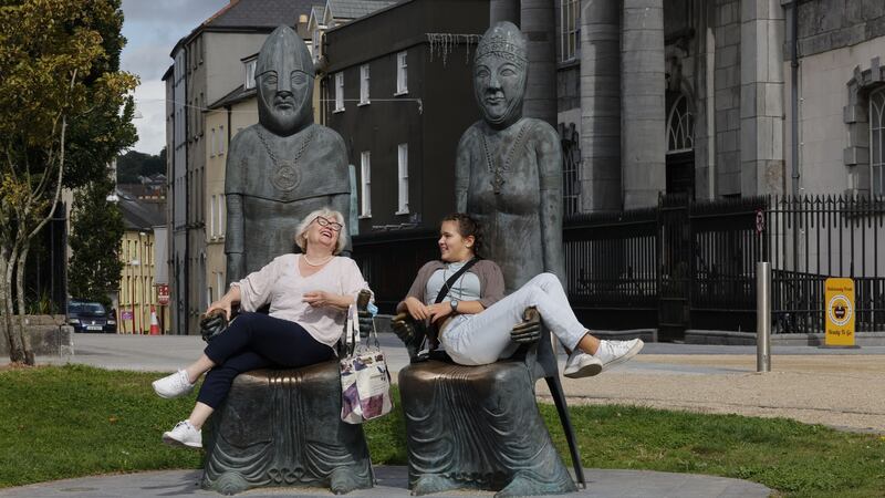 Lana Elez and Dordana Gojic from Serbia take a seat on the Marriage of Strongbow and Aoife sculptures in the Viking Triangle of Waterford city. Photographs: Alan Betson