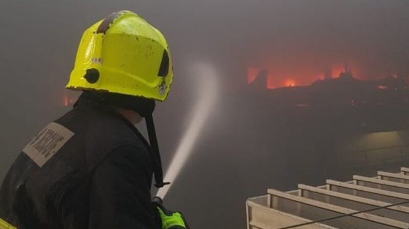 A firefighter tackles the blaze at the Douglas Village multistorey car park on Saturday. Photograph: Cork Fire Brigade via Twitter
