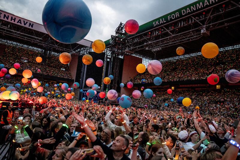 Fans cheer as Coldplay performs at Parken Stadium in Copenhagen last month as part of their Spheres World Tour. Photograph: Mads Claus Rasmussen/Ritzau Scanpix/AFP via Getty Images