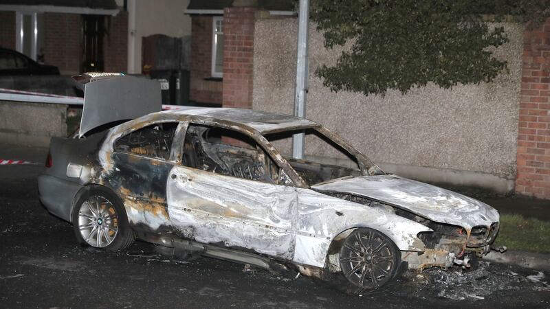 The  silver BMW 3 Series car  was found burned out  at Saddlers Grove, Mulhuddart. Gardaí believe that this car was involved in the shooting. Photograph: Brian Lawless/PA Wire