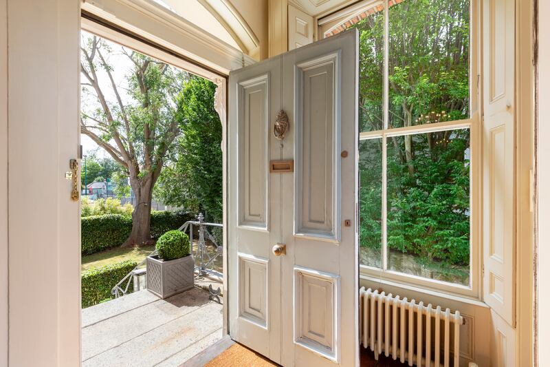 The main entrance door to 5 Palmerston Villas is up a flight of granite steps, opening on to an entrance hall with oak flooring