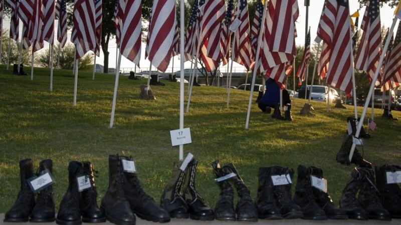 ‘The Healing Field 9/11 memorial in Tempe, Arizona is heartbreakingly beautiful, each one of its 2,996 flags signifying a life taken on that horrific autumn morning... On the grass, for veterans lost that day, pair after pair of combat boots.’