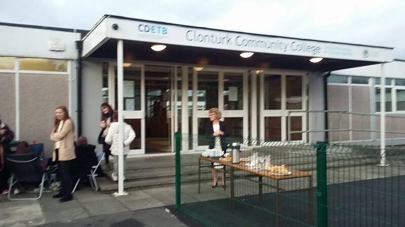 Parents queue outside Clonturk Community College, in Whitehall, Dublin, in order to secure school places for their children. Photograph: Clonturk Community College/Facebook