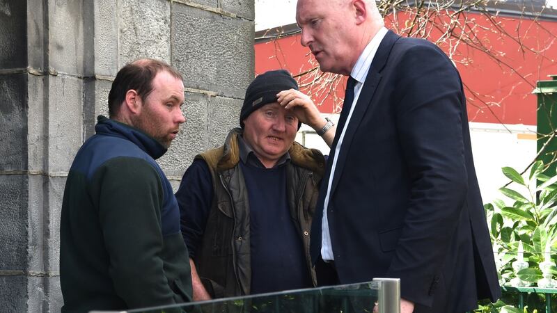 John Casey Junior and John Casey Snr  speaking to their solicitor Padraig O’Connell  outside Killarney District Court on Tuesday. Photograph: Michelle Cooper Galvin