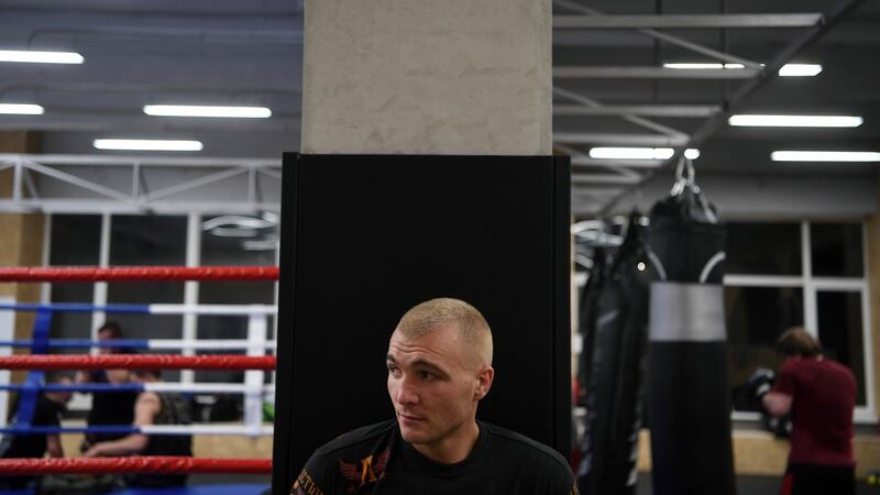 Yevgeny Berezin leads a fight training session for a group of Russian soccer hooligans at a gym in Moscow. Photograph: James Hill/The New York Times