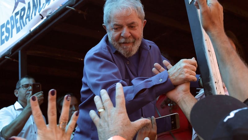 Brazil’s former president Luiz Inacio Lula da Silva greets supporters during a rally in Francisco Beltrao, Parana state, Brazil, on Monday. Photograph: Eraldo Peres/AP