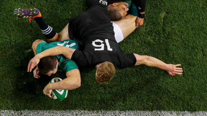 Jacob Stockdale scores a try for Ireland against the All Blacks. Photograph: Tommy Dickson/Inpho