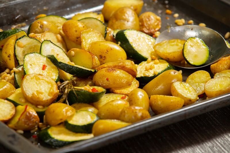 Roast potatoes, courgettes, lemon and pinenuts. Photograph:   Patrick Browne