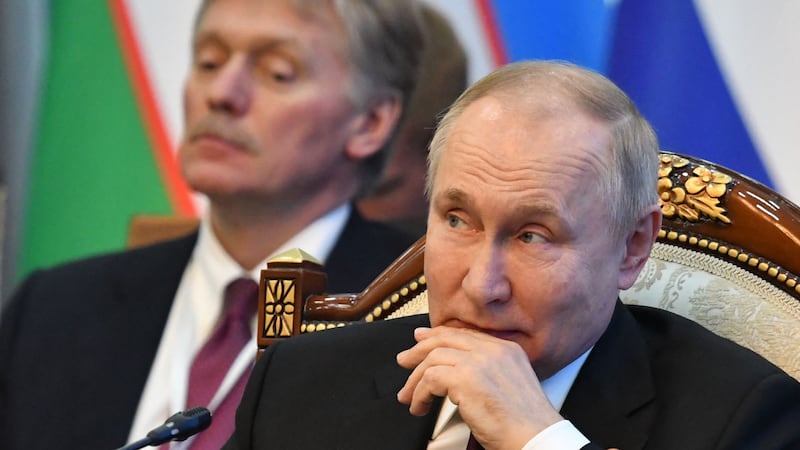 Russia's president Vladimir Putin and his spokesman Dmitry Peskov. Photograph: Vyacheslav Oseledko/AFP via Getty Images