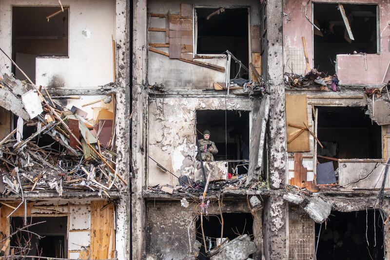 An Ukrainian soldier inspect inside a residential building in Kyiv on February 25th after it was damaged in a Russian shelling attack. Photograph: Mykhaylo Palinchak/SOPA Images/LightRocket via Getty