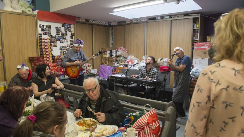 Jack O’Rourke entertains the clients in Cork’s Penny Dinners on Christmas Day. Photograph: Michael Mac Sweeeney/Provision