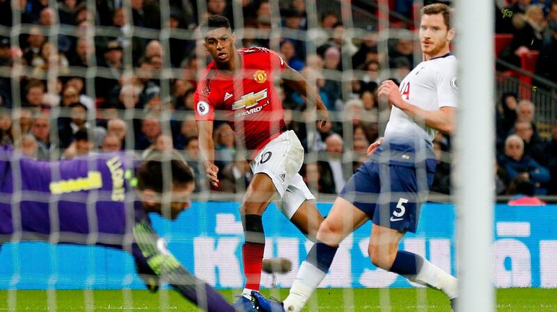 Manchester United striker Marcus Rashford shoots past Tottenham Hotspur  goalkeeper Hugo Lloris  to score in the  Premier League match at Wembley. Photograph: Ian Kington/Ikimages/AFP