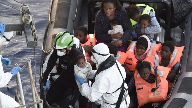 Crew of the Irish Navy vessel LÉ Éithne rescue refugees in the Mediterranean. Photograph: David Jones/Irish Defence Forces/PA Wire